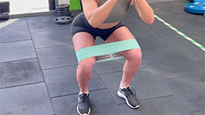 Glute band squat activation exercise knee rehabilitation